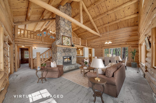 carpeted living room with a fireplace, stairway, wooden ceiling, high vaulted ceiling, and log walls