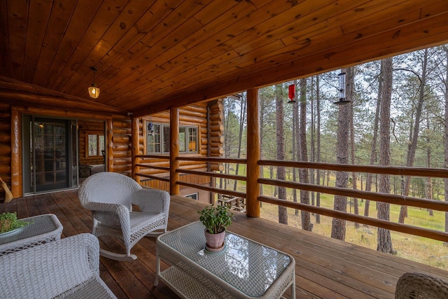 sunroom / solarium with lofted ceiling and wood ceiling