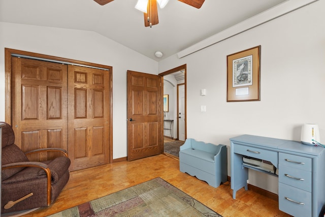 sitting room with lofted ceiling, ceiling fan, and light wood finished floors