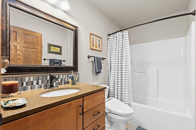 bathroom with tasteful backsplash, vanity, toilet, and shower / tub combo