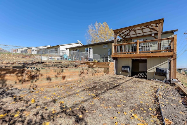 back of property with a wooden deck