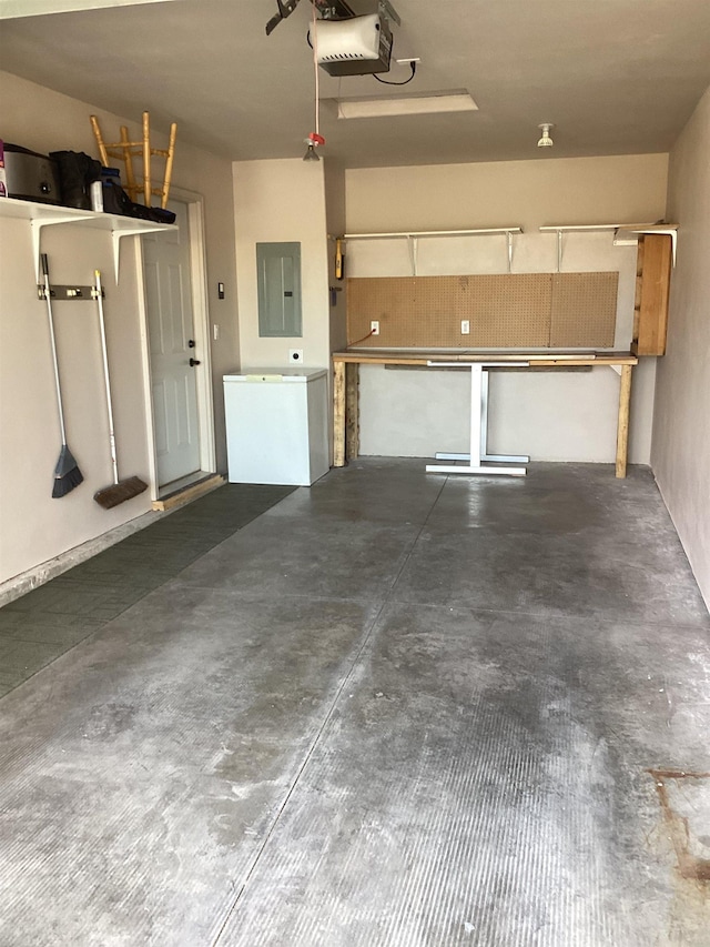 garage with electric panel and a garage door opener