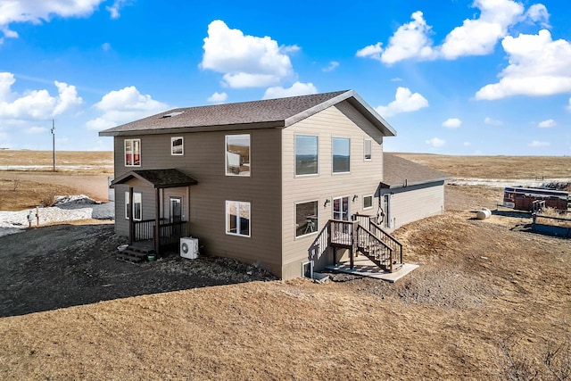 23165 Justice Rd, Rapid City, SD 57703 - rear view of house featuring roof with shingles