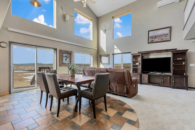 carpeted dining space featuring ceiling fan, baseboards, a wealth of natural light, and a wall mounted air conditioner