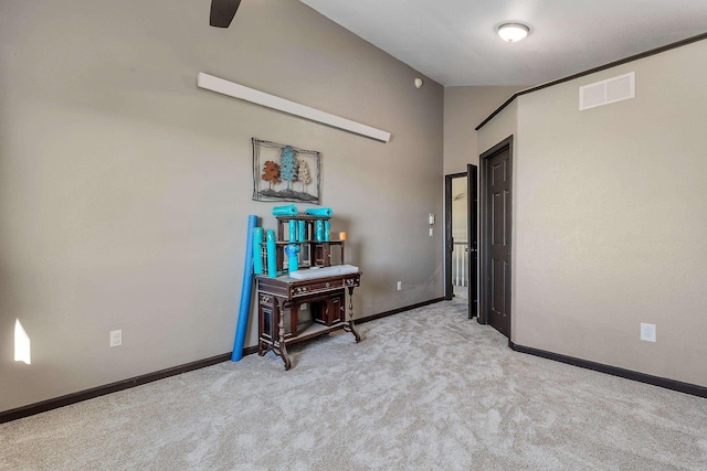 carpeted empty room with baseboards, visible vents, and ceiling fan