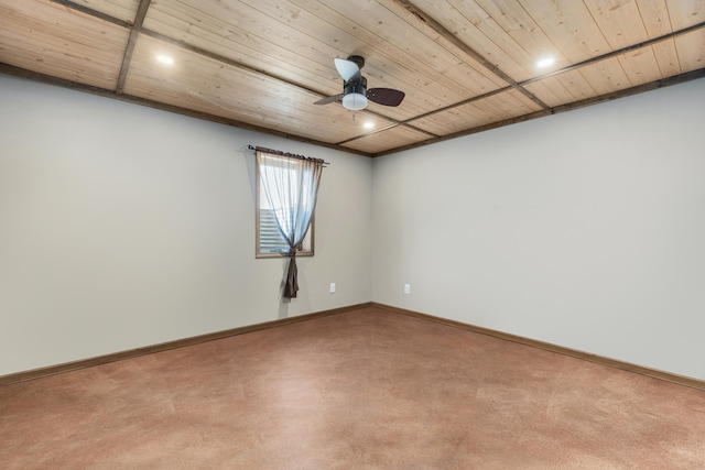 empty room featuring wood ceiling, baseboards, and ceiling fan