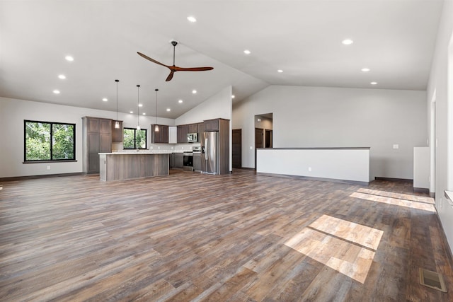 unfurnished living room featuring ceiling fan, high vaulted ceiling, recessed lighting, wood finished floors, and visible vents