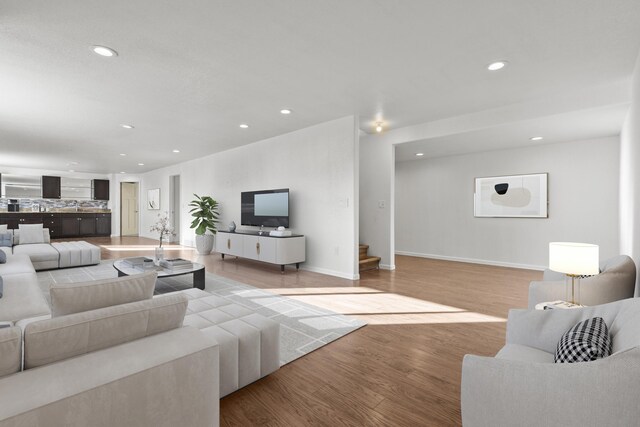 3316 Other, Rapid City, SD 57701 - living area with baseboards, stairway, light wood-style flooring, and recessed lighting