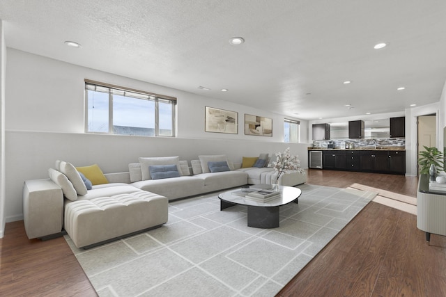 3316 Other, Rapid City, SD 57701 - living room featuring a textured ceiling, recessed lighting, wood finished floors, and a healthy amount of sunlight
