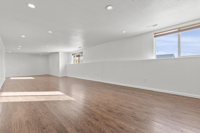 3316 Other, Rapid City, SD 57701 - empty room featuring baseboards, wood finished floors, and recessed lighting