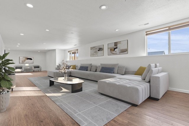 3316 Other, Rapid City, SD 57701 - living room featuring recessed lighting, visible vents, a textured ceiling, and wood finished floors