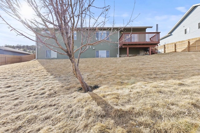 3316 Other, Rapid City, SD 57701 - back of house with a deck, a yard, and a fenced backyard
