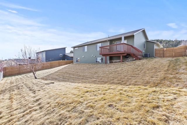 3316 Other, Rapid City, SD 57701 - back of property featuring a deck, a fenced backyard, central air condition unit, stairs, and a yard
