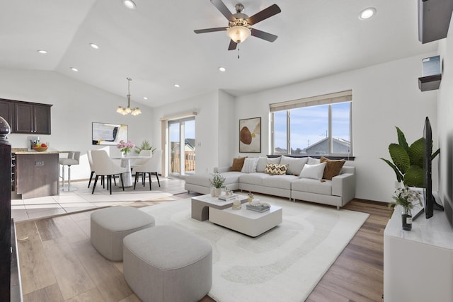 3316 Other, Rapid City, SD 57701 - living room with lofted ceiling, light wood-type flooring, ceiling fan with notable chandelier, and recessed lighting