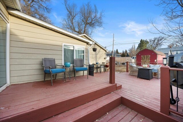 deck with fence and an outdoor structure