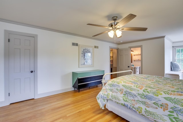 bedroom featuring baseboards, visible vents, ceiling fan, ornamental molding, and light wood-style floors