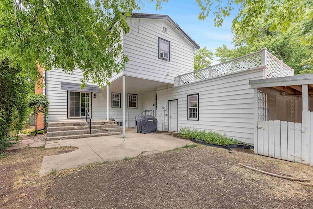 back of house with a patio area