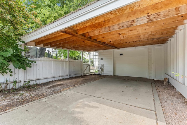 exterior space featuring fence and a carport