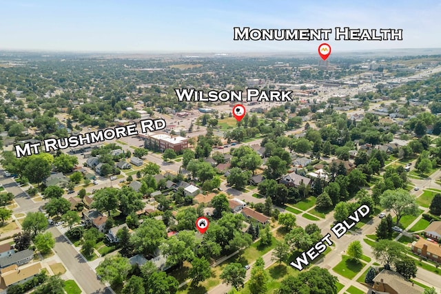 birds eye view of property with a residential view