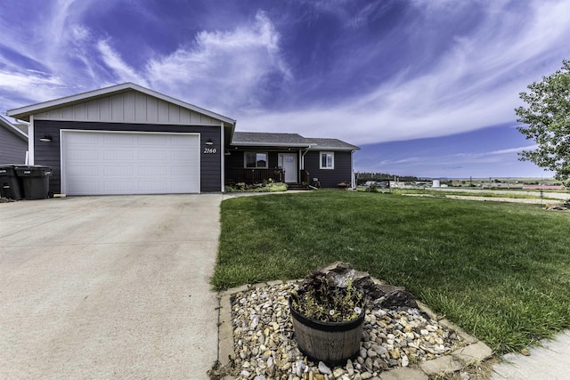 ranch-style home with a garage, concrete driveway, board and batten siding, and a front yard