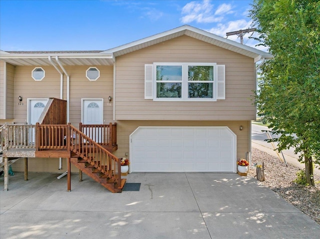 split foyer home with driveway and an attached garage