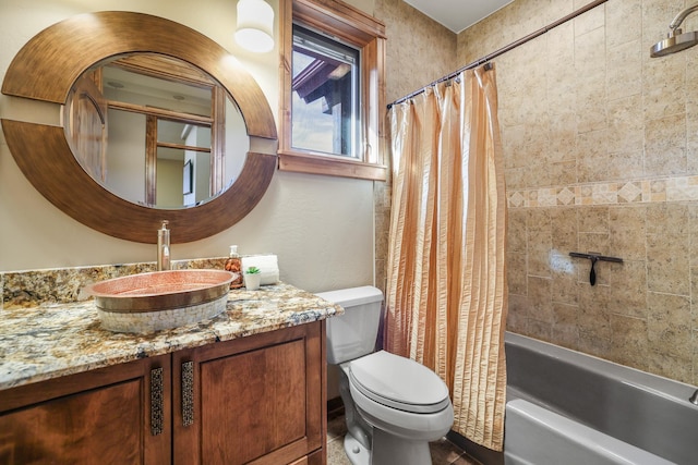 bathroom with toilet, shower / bath combination with curtain, and vanity