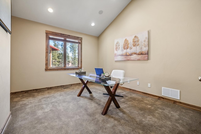 unfurnished office featuring lofted ceiling, recessed lighting, visible vents, carpet flooring, and baseboards