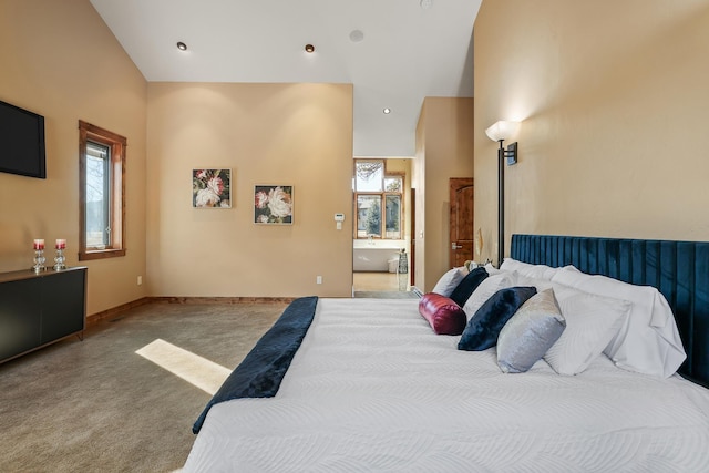 bedroom featuring vaulted ceiling, multiple windows, carpet flooring, and baseboards