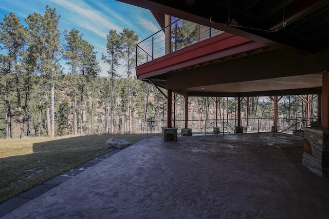 view of patio with a wooded view