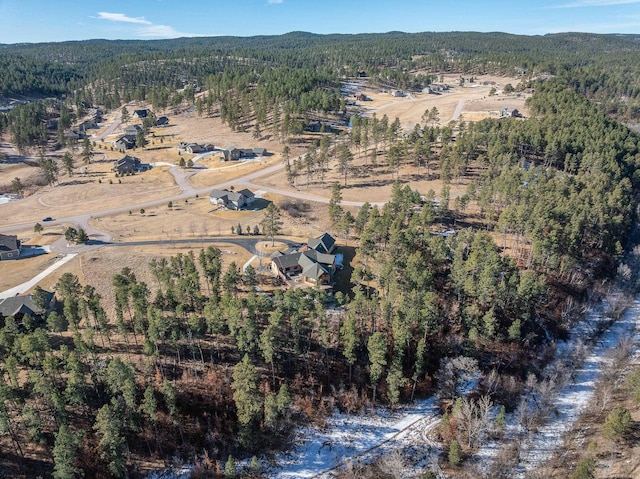 bird's eye view featuring a view of trees