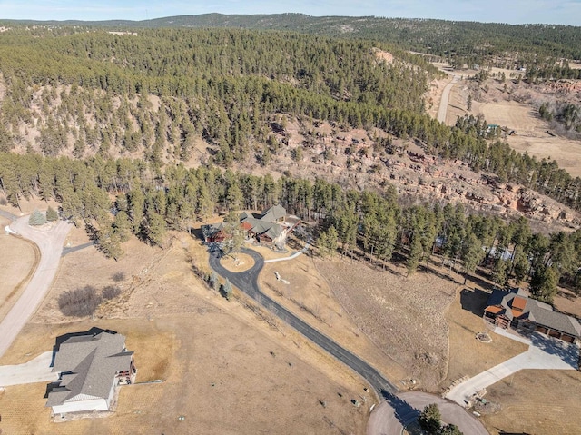 drone / aerial view with a view of trees