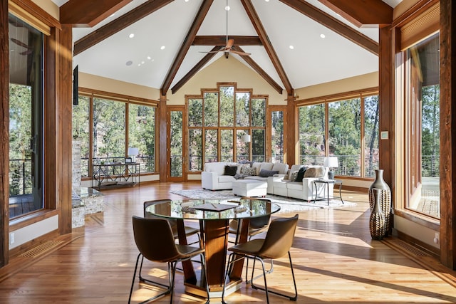 sunroom with visible vents and vaulted ceiling with beams