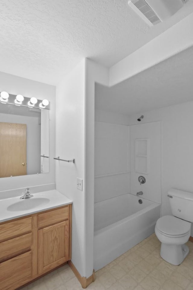 bathroom with visible vents, toilet, tile patterned floors, a textured ceiling, and vanity