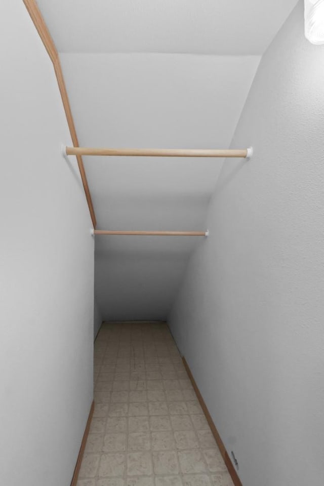 interior space with light floors and baseboards