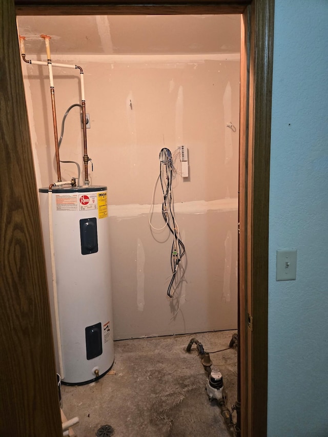 utility room with electric water heater