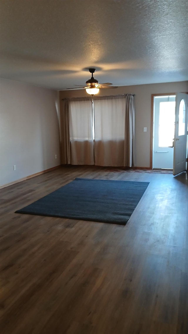 885C E Minnesota St, Rapid City, SD 57701 - empty room with baseboards, a textured ceiling, ceiling fan, and wood finished floors