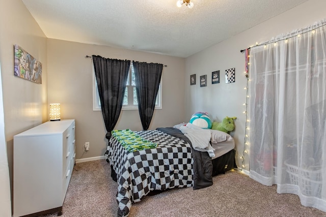 bedroom featuring carpet floors, a textured ceiling, and baseboards