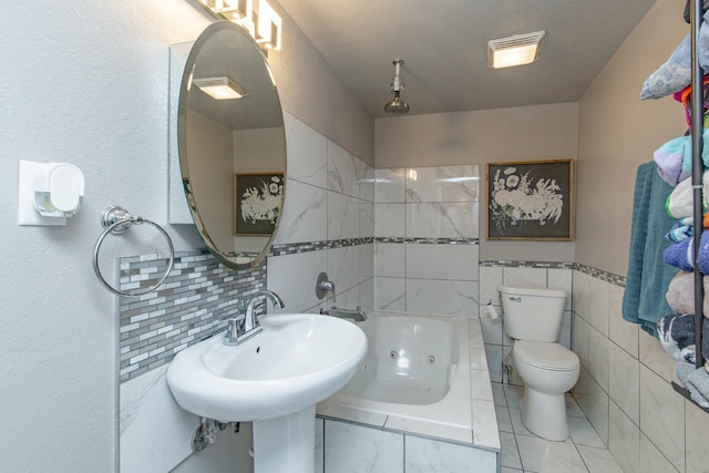 bathroom with a combined bath / shower with jetted tub, tile walls, and toilet