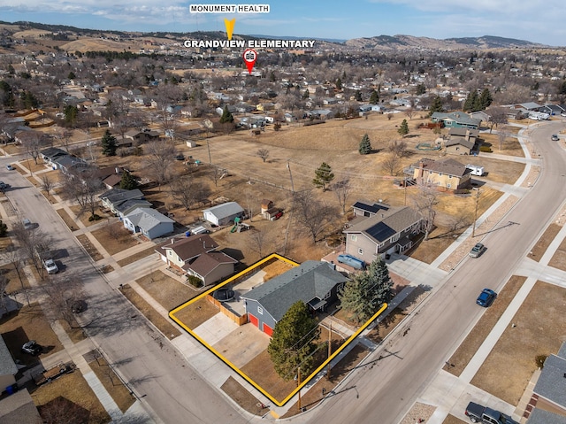 drone / aerial view featuring a mountain view and a residential view