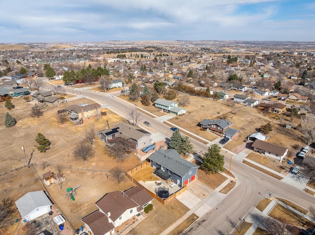 birds eye view of property with a residential view