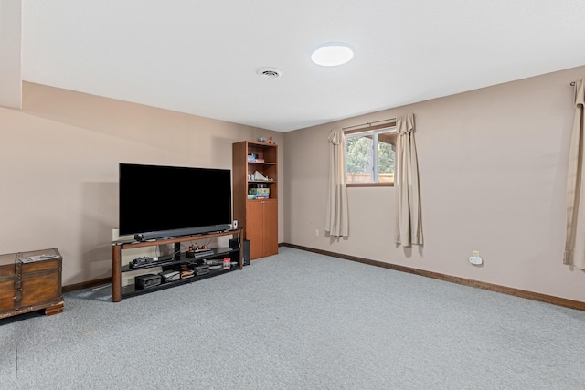 carpeted living room with visible vents and baseboards