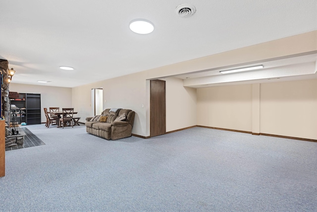 interior space featuring carpet floors, visible vents, and baseboards