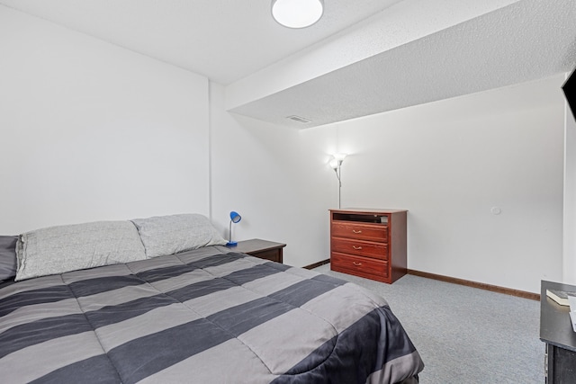 bedroom with carpet flooring, visible vents, and baseboards