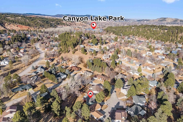 drone / aerial view featuring a residential view and a mountain view