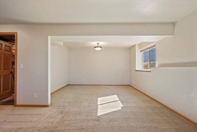 empty room with carpet floors and baseboards