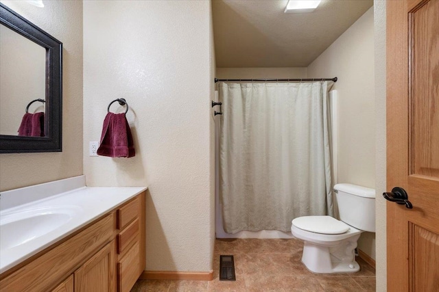 bathroom with curtained shower, visible vents, a textured wall, toilet, and vanity