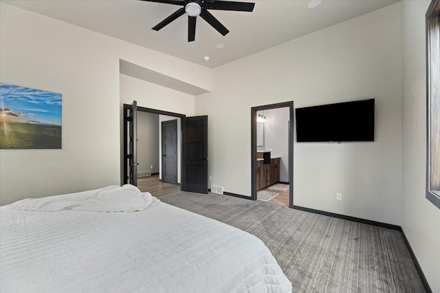 bedroom featuring light carpet, visible vents, baseboards, and a ceiling fan