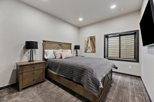 carpeted bedroom with recessed lighting, baseboards, visible vents, and a textured wall