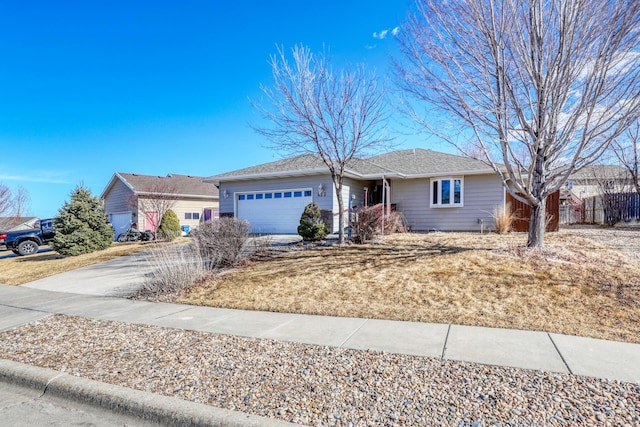 single story home with a garage and driveway