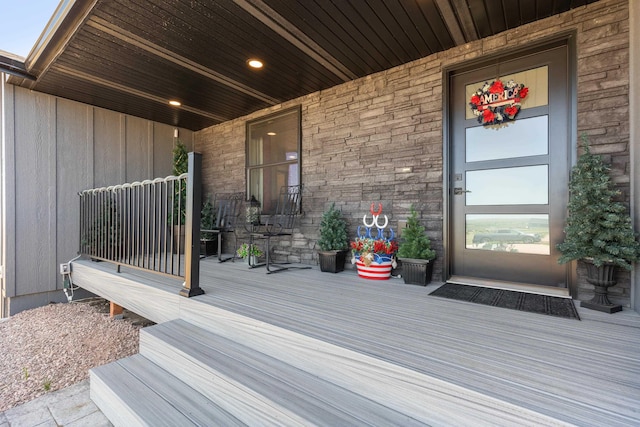 wooden terrace with a porch